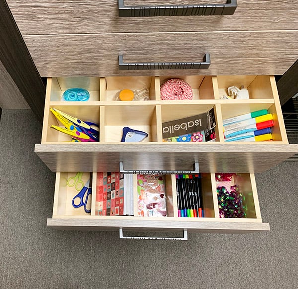 Organized craft and hobby supplies in drawer