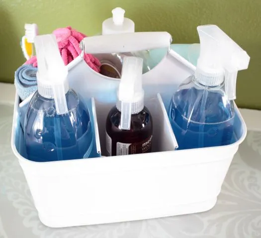 Cleaning supplies tidy in caddy under the sink