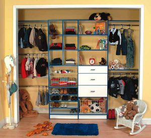 reach in closet with toys and clothes organized and decluttered