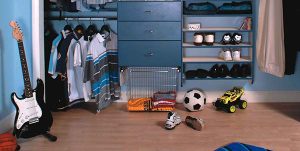 reach in boys closet with toys organized and decluttered