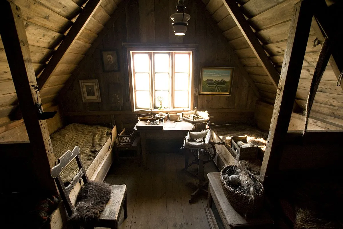 Attic bedroom neatly organized with storage