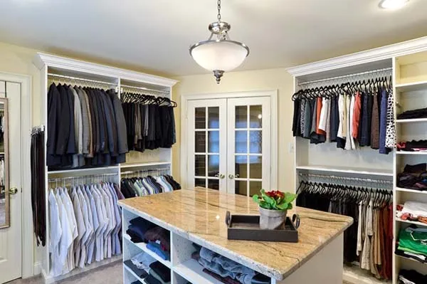 Walk-in closet with center island and double hanging sections