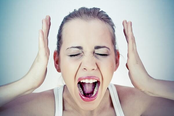 Woman frustrated and screaming from stress