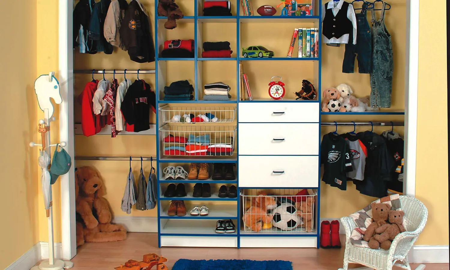 Kids closet neatly organized with custom shelves