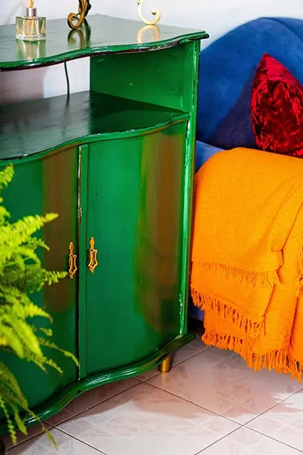 Vibrant green cabinet near couch