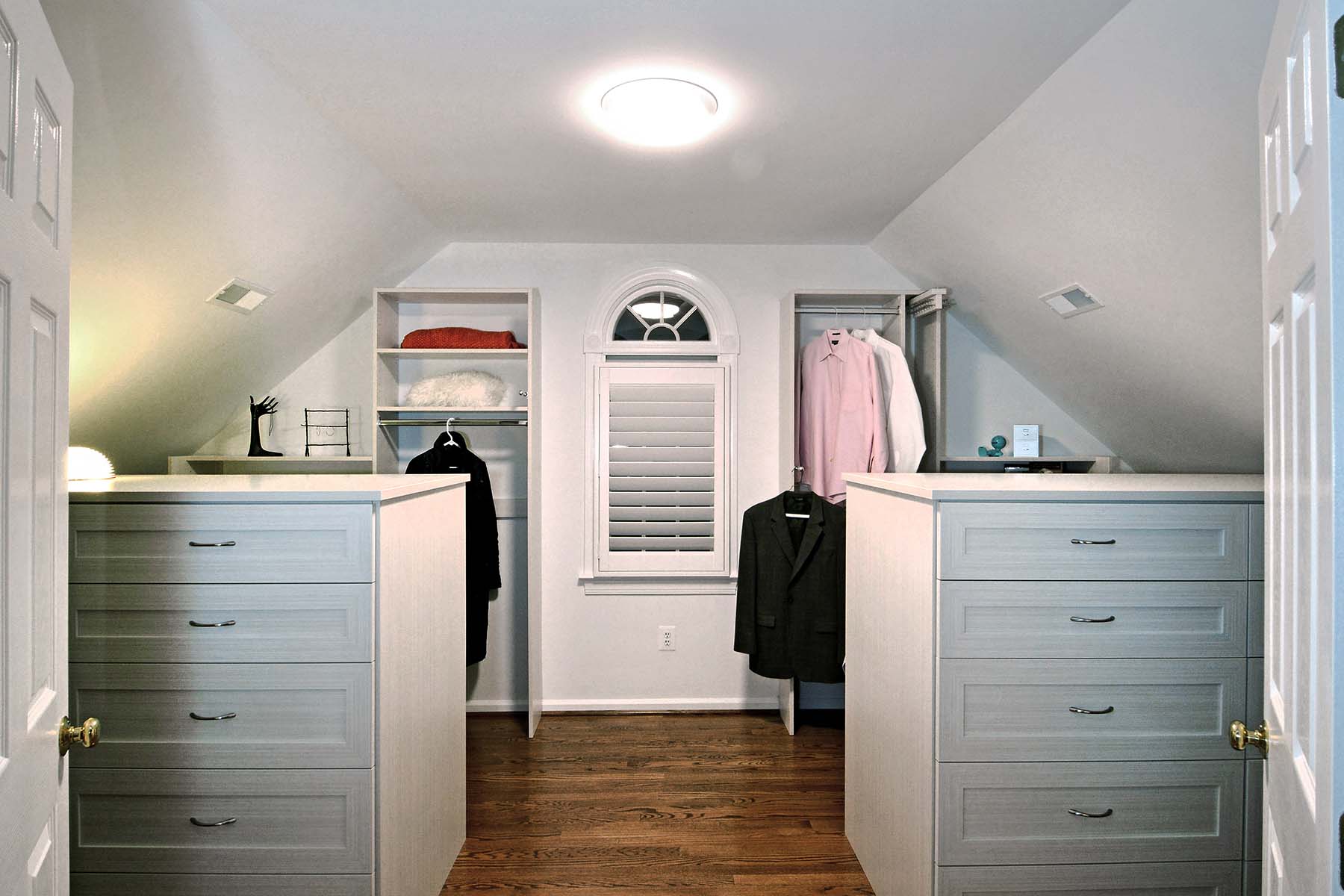 Walk in closet with slanted ceiling