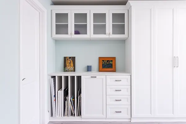 Craft room with vertcial storage for art canvases and Murphy bed