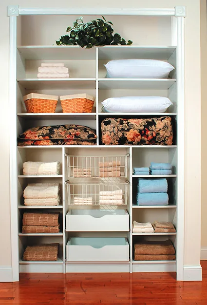 Reach-in closet with linens organized