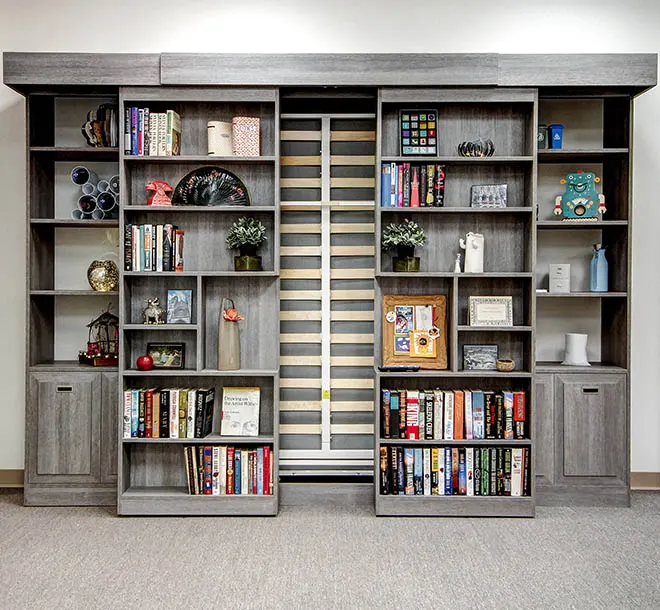Sliding bookcase doors slid open slightly to reveal a Murphy Bed frame