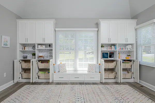 Children's playroom with slide out baskets organizing school supplies