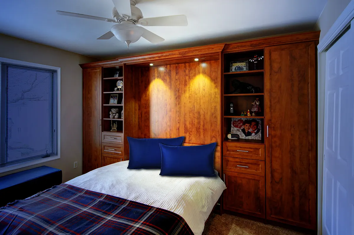 Murphy bed neatly made and set for guest room