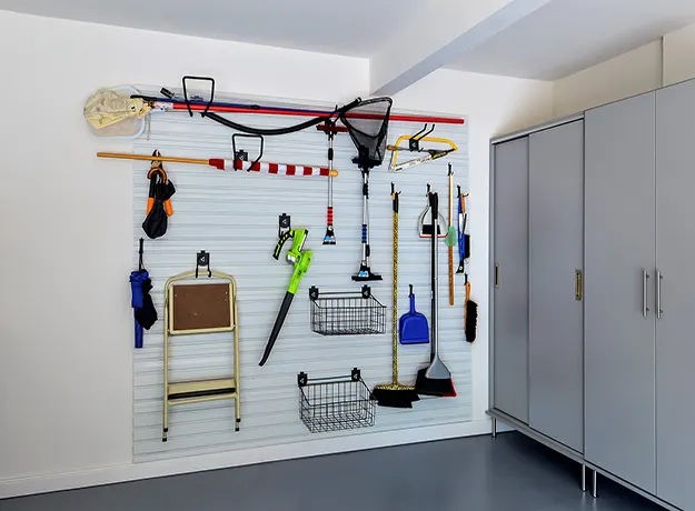 Garage with metal cabinets and Slatwall System