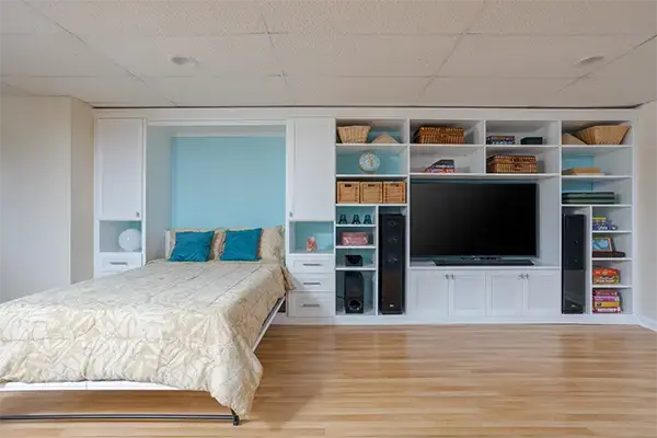 Murphy bed with entertainment center along single wall