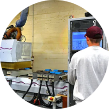Engineer in warehouse putting dimensions into computer